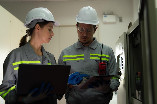 electric power engineering team inspecting system large solar energy storage station middle field solar cells area hundreds acres